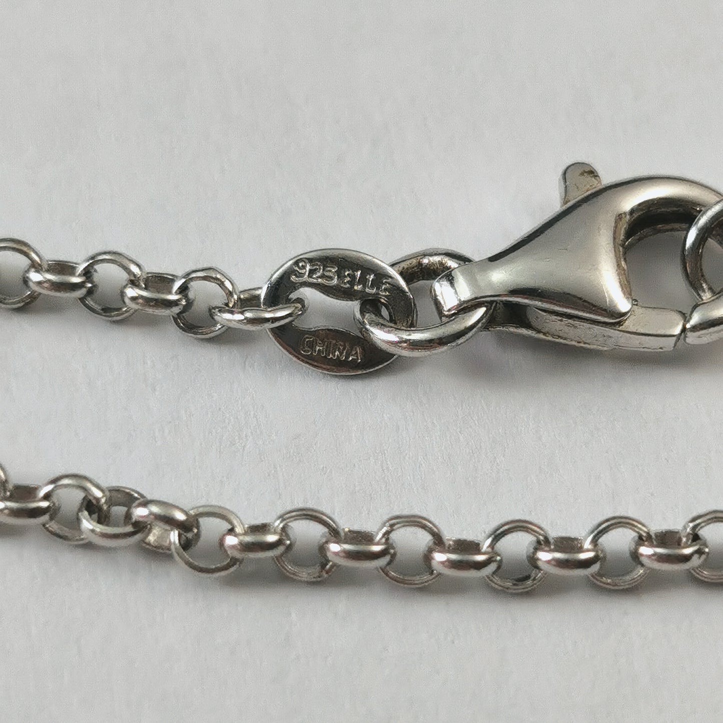 Elle Sterling Silver 23.5" Rolo Chain with Ruby Logo Tag